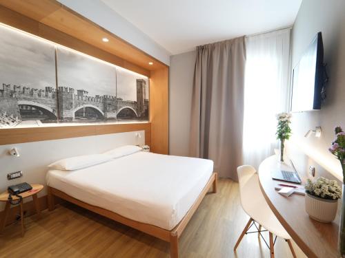 Postel nebo postele na pokoji v ubytování Cavallo Hotel Verona Est