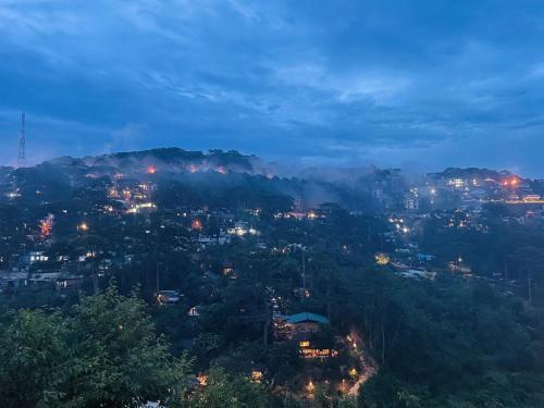 a view of a city at night at Cú Trên Cây Homestay in Xuan An