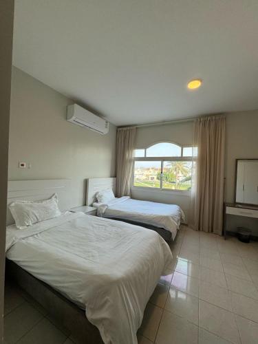 Ένα ή περισσότερα κρεβάτια σε δωμάτιο στο Rotana Villa - فيلا روتانا