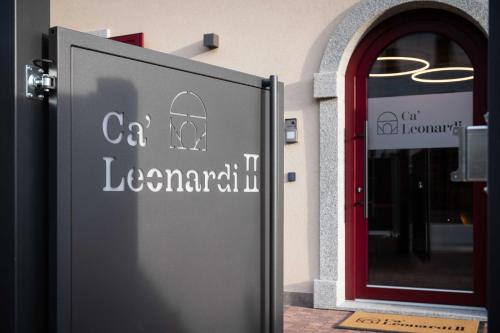 a door to a building with a cat leavenitarian sign at Ca' Leonardi II - Ledro in Tiarno di Sotto