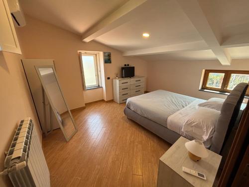 a bedroom with a bed and a dresser at Intero Appartamento a Sant'Agnello , Le Ortensie in Sant'Agnello