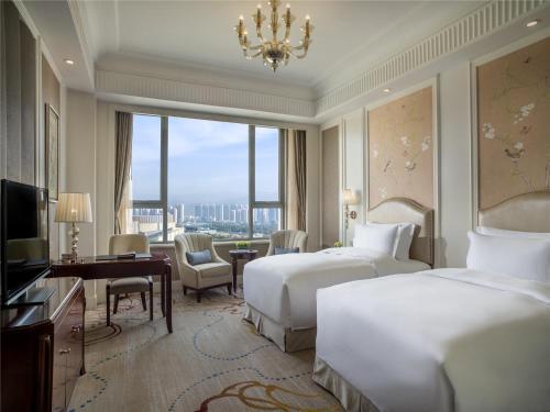 Un ou plusieurs lits dans un hébergement de l'établissement Sofitel Xining