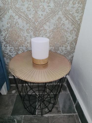 a rattan table with a bucket on top of it at Casa-Cristiano in Sutomore