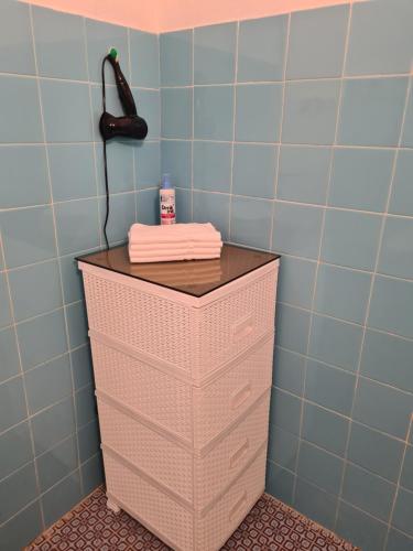 a cabinet in a bathroom with a phone on it at Casa-Cristiano in Sutomore