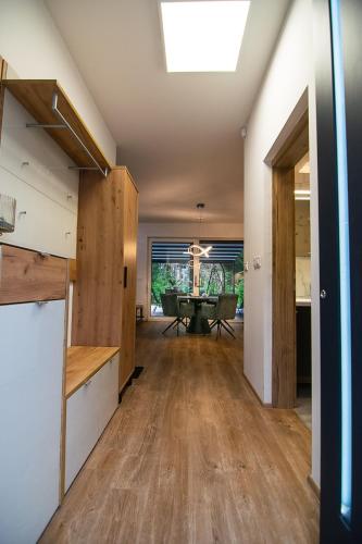 an open living room with a ping pong table at Apartments Villa Prod in Ljubljana
