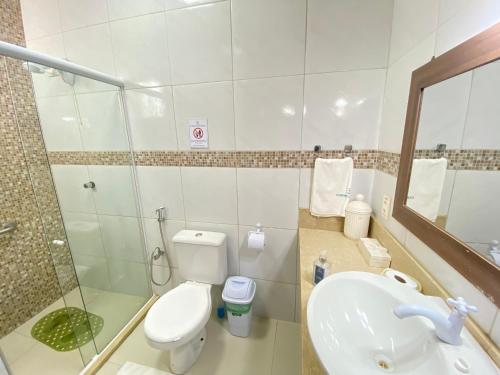 a bathroom with a toilet and a sink and a shower at Condado da Praia ,casa em Flecheiras 7 a 10 suítes in Flecheiras