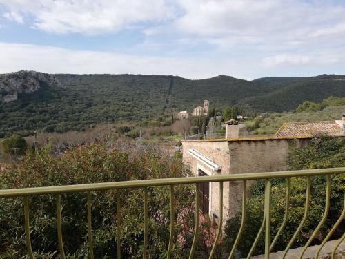 a view from the balcony of a house in the mountains at Maison vue Panoramique in Vailhan