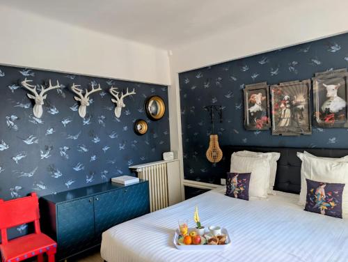 Postel nebo postele na pokoji v ubytování Hôtel Mademoiselle