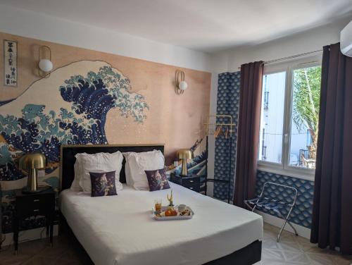 Postel nebo postele na pokoji v ubytování Hôtel Mademoiselle