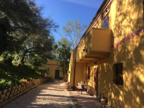 a hallway of a building with chairs and a wall at Agriturismo Fattoria Del Colle By Enrico in Casa Cappanera