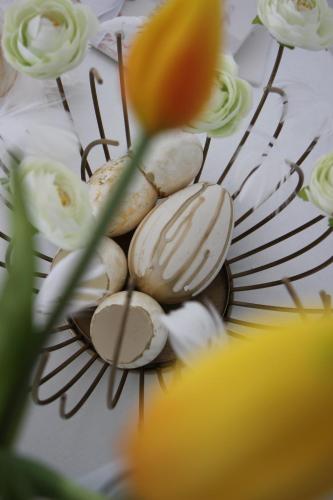a bunch of shells on a plate with flowers at Villa Loreta in Ischia