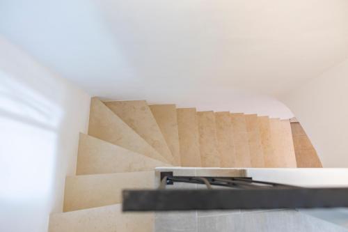 a set of stairs in a room with cardboard at Torre delle Rondini in Isolabona