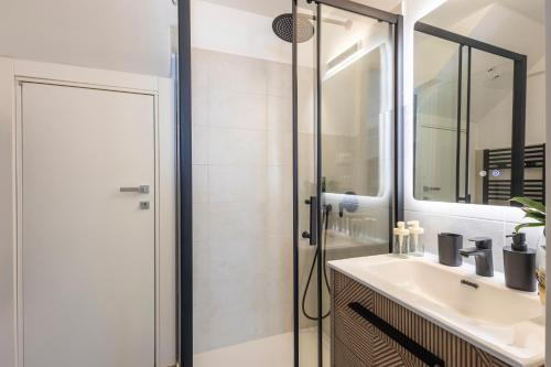 a bathroom with a sink and a shower at Torre delle Rondini in Isolabona