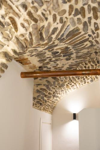 a room with a faux rock ceiling with a light at Torre delle Rondini in Isolabona