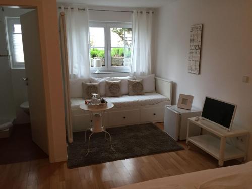 Χώρος καθιστικού στο Privatzimmer Kippenhausen