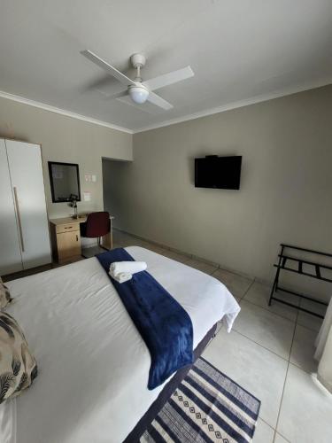 Cama o camas de una habitación en UNIQUE Self-Catering