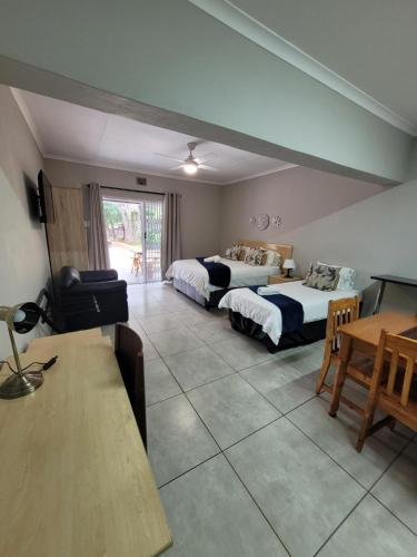 Cama o camas de una habitación en UNIQUE Self-Catering