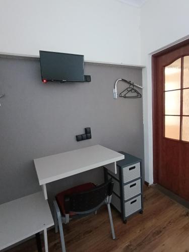 an office with a desk and a chair and a desk at Noclegi "Poza Szlakiem" in Wałbrzych