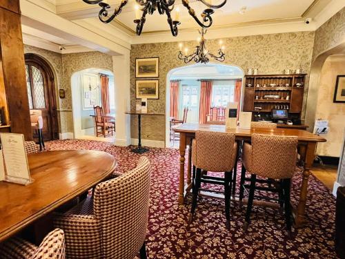 a dining room with a table and chairs at Ye Olde Bell Hotel & Spa in Retford