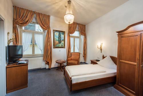 
Ein Bett oder Betten in einem Zimmer der Unterkunft Hotel Goldener Löwe
