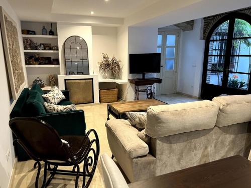 Télévision ou salle de divertissement dans l'établissement La casa del Retablo