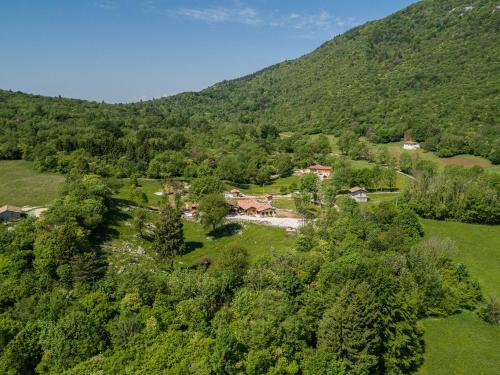 an aerial view of a village in the mountains at Agriturismo Fattoria Carolina - Friuli Venezia Giulia - Val d'Arzino in Vito dʼAsio