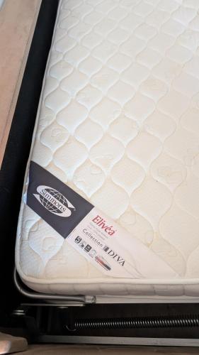 a mattress in a box with a label on it at Cosy T2 refait à neuf climatisé, vue mer avec terrasse et jardin, Wifi piscine tennis et parking in Sète