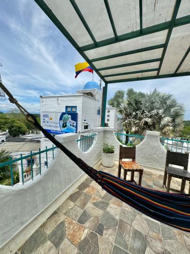 a hammock on the roof of a resort at Plaza Blanca in Doradal