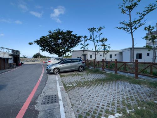 a car parked on the side of a road at 去七星潭-海景電梯民宿Qixingtan in Dahan