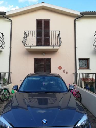 a blue car parked in front of a building at Casa House Villa Chiara in Pula