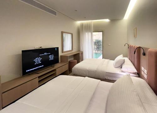 Giường trong phòng chung tại شقة فندقية في الشيخ زايد - Zayed Suites D