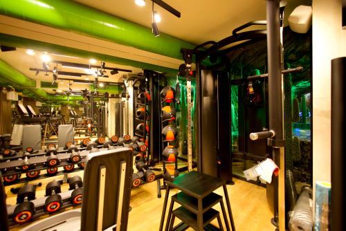 a room with a gym with a stool in it at Carat Hotel Yerevan in Yerevan