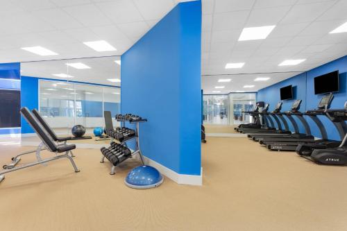 a gym with rows of chairs and blue walls at Holiday Inn Resort Kissimmee by the Parks by IHG in Orlando