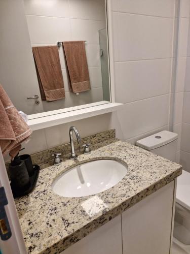 a bathroom with a sink and a mirror at Skylux 906 - Studio in Rio de Janeiro