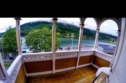 a room with a large window with a view of a river at Apartment in Stryn in Stryn