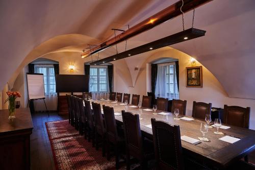 a large room with a long table and chairs at Boutique Hotel ERB - Adults Only in Banská Štiavnica