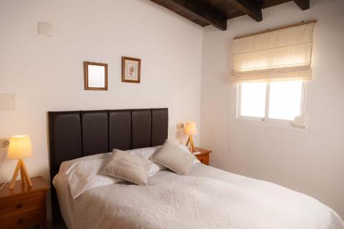 A bed or beds in a room at Apartamento Marina Nacional