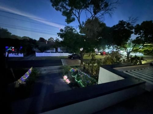 a view of a yard at night with christmas lights at 89B - Your Dream Stay Business or Travel Mornings with coffee in Bentleigh in Heatherton