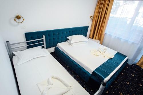 Postel nebo postele na pokoji v ubytování Hotel & MedSpa Siret