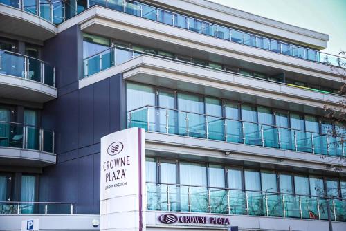 a building with a sign in front of it at Crowne Plaza London - Kingston by IHG in Kingston upon Thames