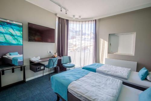 Voodi või voodid majutusasutuse Best Western Plus Hotel Ilulissat toas