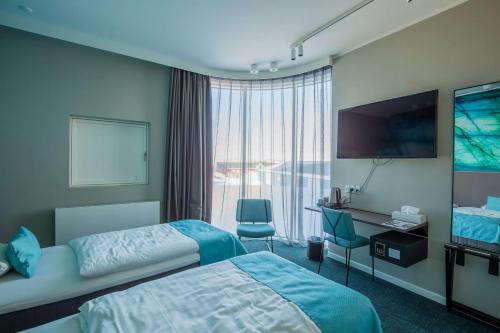 Voodi või voodid majutusasutuse Best Western Plus Hotel Ilulissat toas