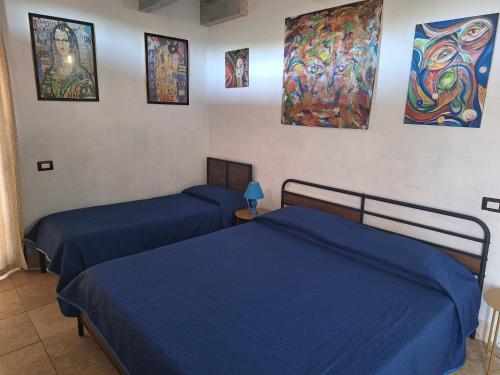 Postel nebo postele na pokoji v ubytování Casa Mattia - B&B in Legno & Paglia