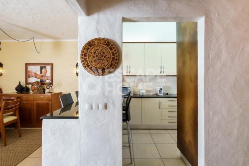 a kitchen and dining room with a table and a counter at Villa Concha do Mar in Porches