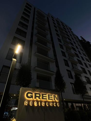 a large building with a sign in front of it at BUB Konak in Ferizaj