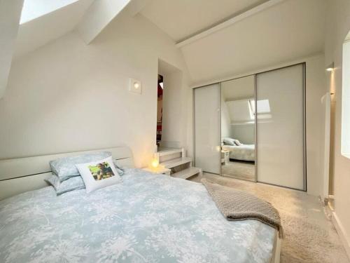 a bedroom with a bed and a large mirror at The Barn in Crumlin