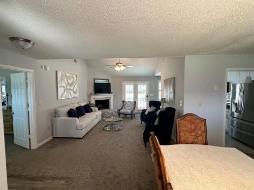 a living room with a bed and a couch at Cozy Stay in Hephzibah in Hephzibah