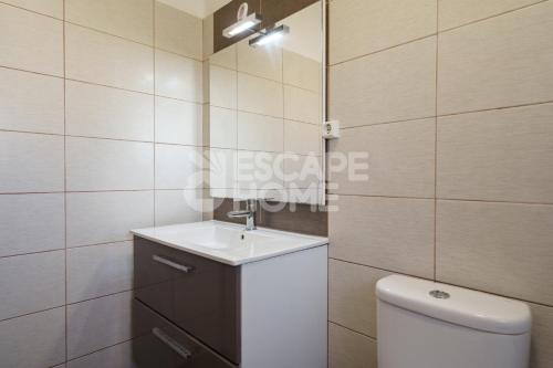 a bathroom with a sink and a toilet in it at Villa Estrela do Mar in Porches