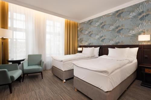 Postel nebo postele na pokoji v ubytování Brovaria Boutique Hotel Stary Rynek - Old Town Square