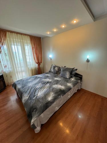 Postel nebo postele na pokoji v ubytování Sunrise apartment